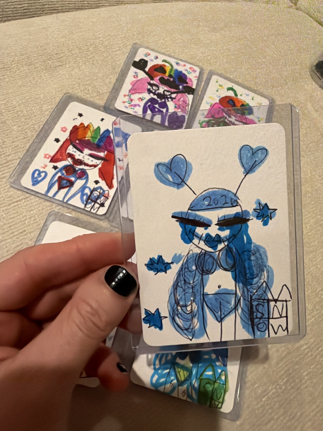 Blue character with heart antennae and the year 2026